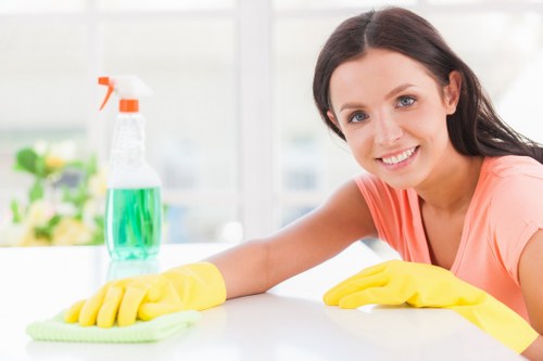 Office cleaners working in a professional workspace in Acton