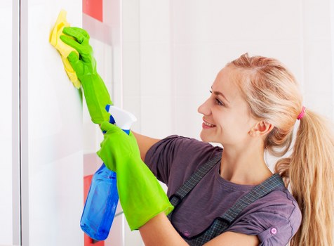 Professional façade cleaning on an Acton building exterior