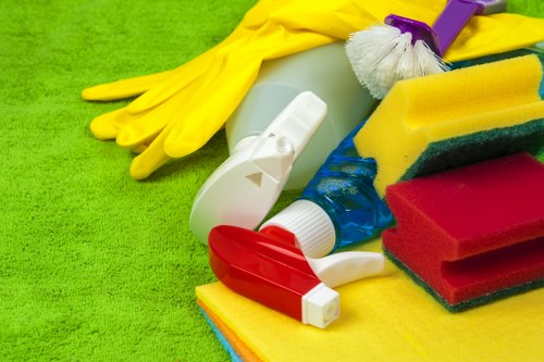 Professional cleaner tidying a family home in Acton