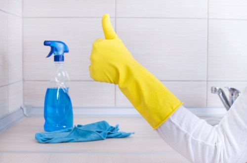 Local deep cleaning team working in an Acton living room